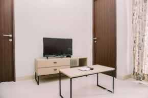 Comfort and Homey 2BR at Transpark Bintaro Apartment By Travelio
